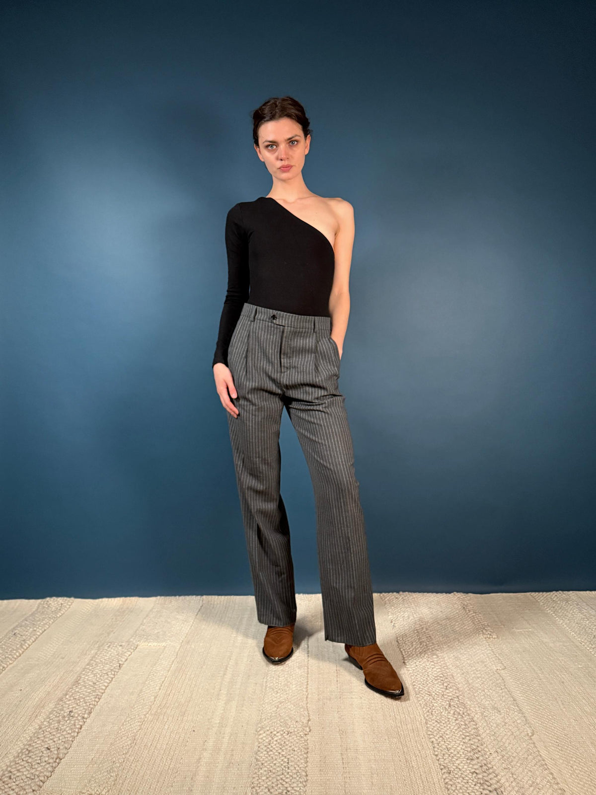 CELINE Pants with a classic pinstripe design in luxury wool fabric